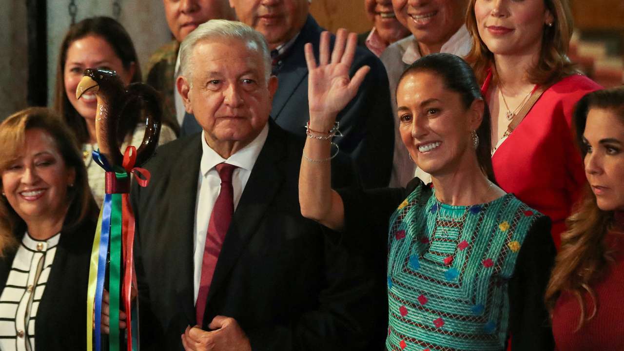 FILE PHOTO: Mexico's President Andres Manuel Lopez Obrador hands over the "baton of command" to Claudia Sheinbaum