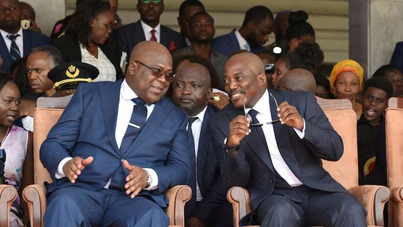 FILE PHOTO: Democratic Republic of Congo's outgoing President Joseph Kabila sits next to his successor Felix Tshisekedi during an inauguration ceremony in Kinshasa