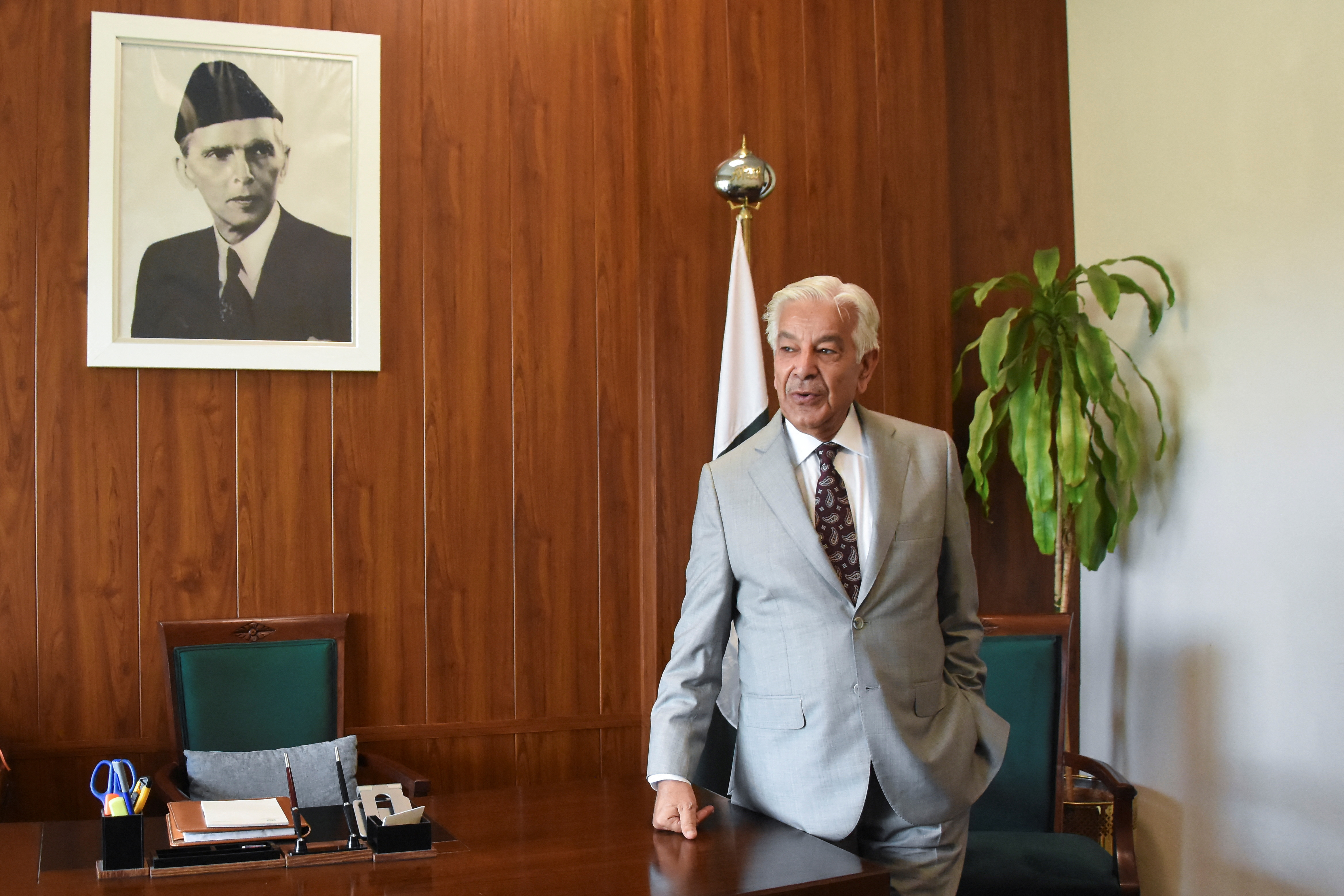 Pakistan’s Defence Minister Khawaja Muhammad Asif stands before an interview with Reuters in Islamabad