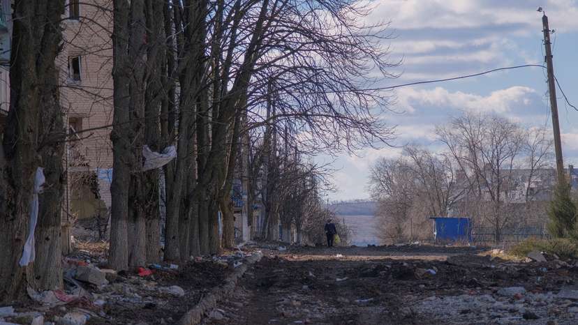 FILE PHOTO: Local resident walks along damaged street in the town of Siversk