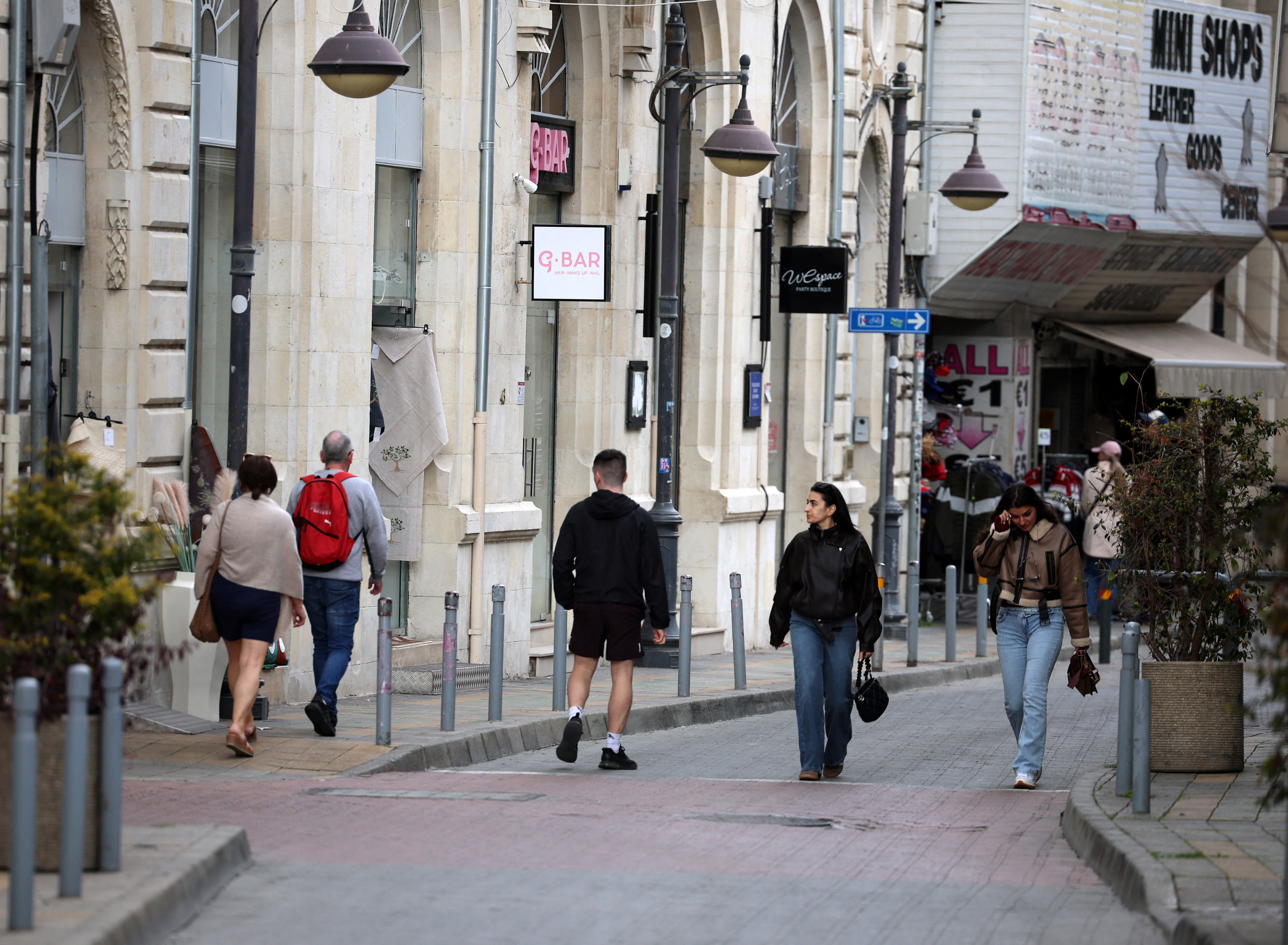 People walk in the coastal city of Limassol