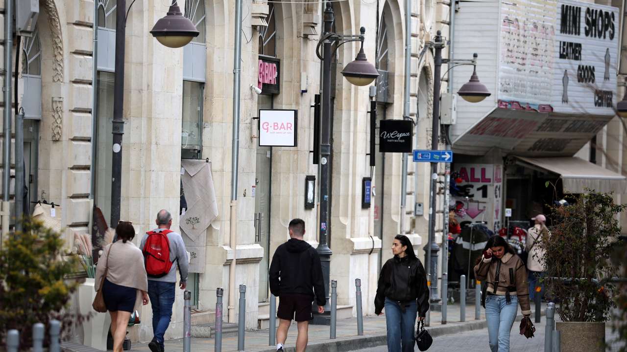 People walk in the coastal city of Limassol