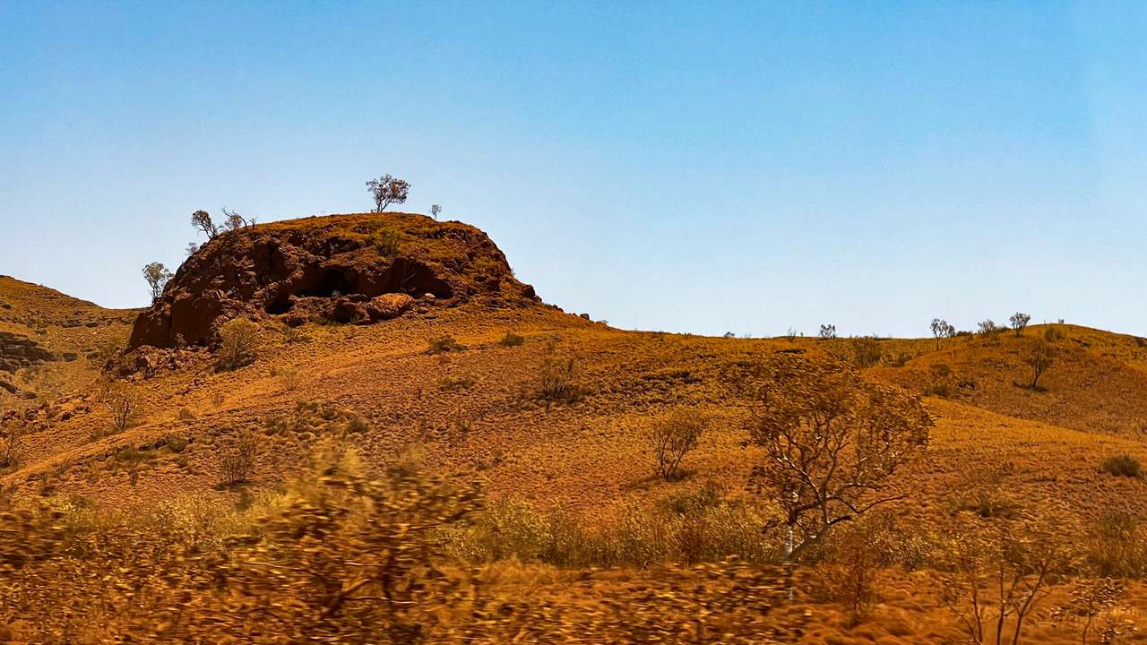 A rocky outcrop holds an Aboriginal shelter of significance in the Pilbara region of Western Australia