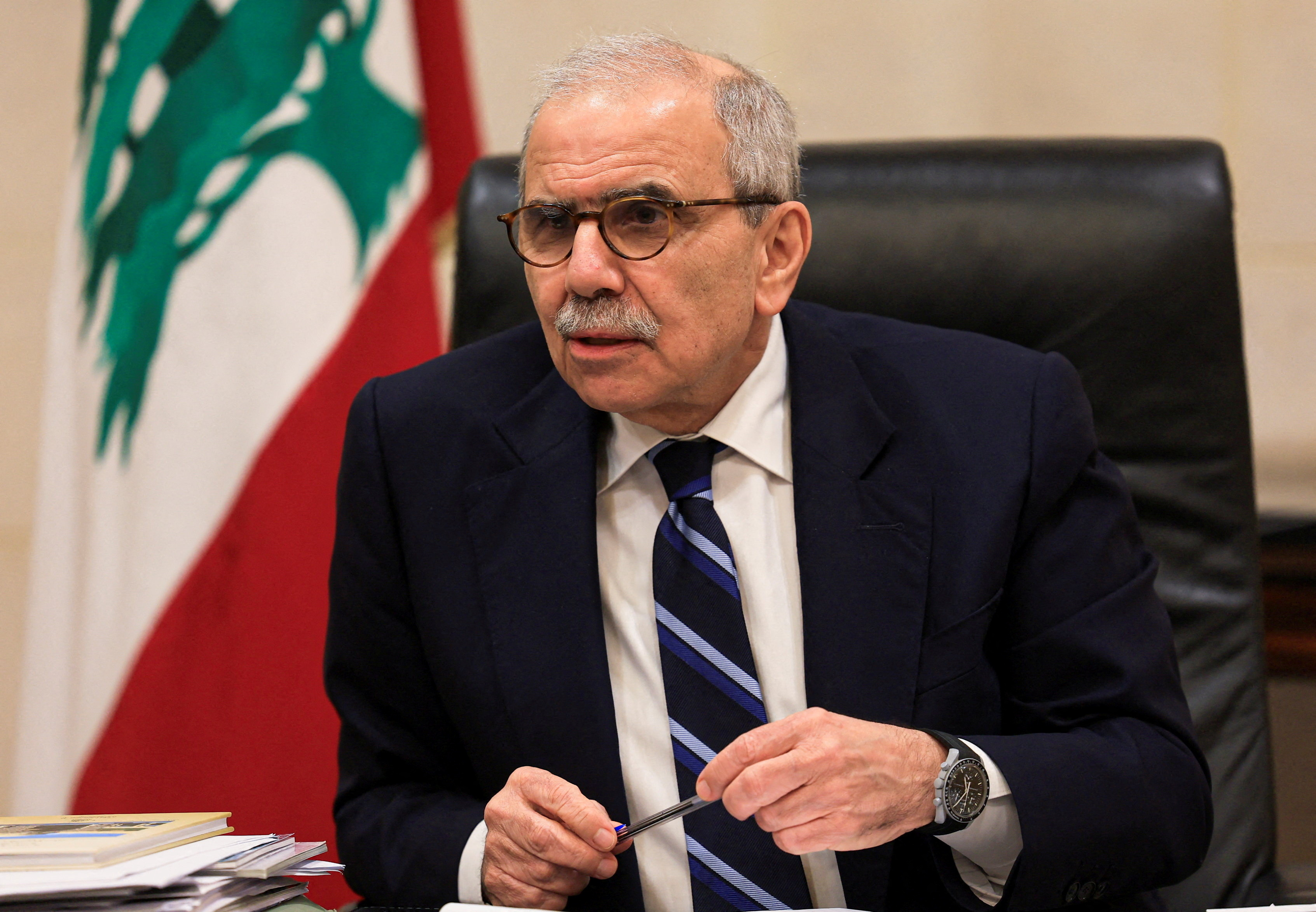 FILE PHOTO: Lebanese Prime Minister Nawaf Salam speaks to journalists at the government headquarters, in Beirut