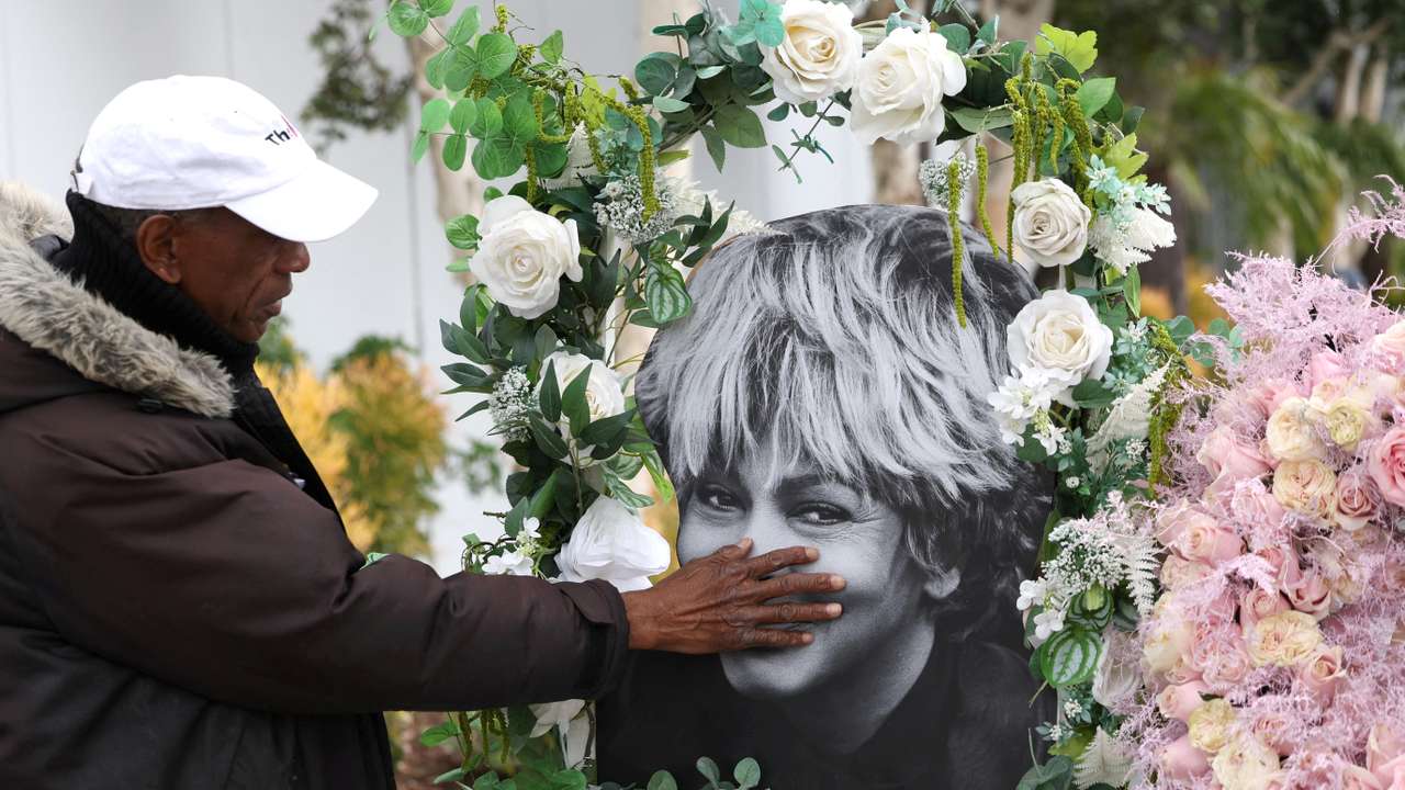 FILE PHOTO: Donnie Green touches a photograph of late singer Tina Turner placed near her star on the Hollywood Walk of Fame in Los Angeles