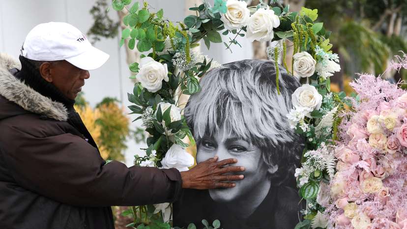 FILE PHOTO: Donnie Green touches a photograph of late singer Tina Turner placed near her star on the Hollywood Walk of Fame in Los Angeles