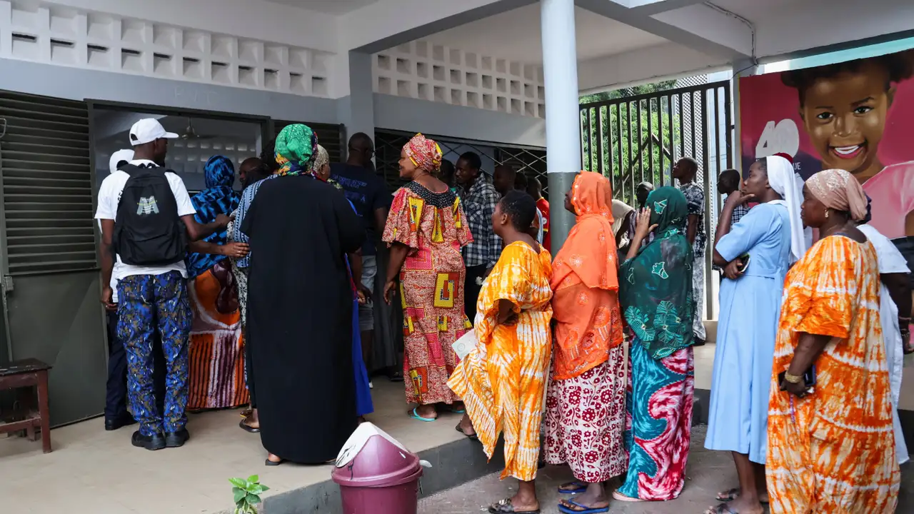 People wait to vote during the presidential election at a polling station in Conakry, Guinea December 28, 2025. REUTERS/ Souleymane Camara