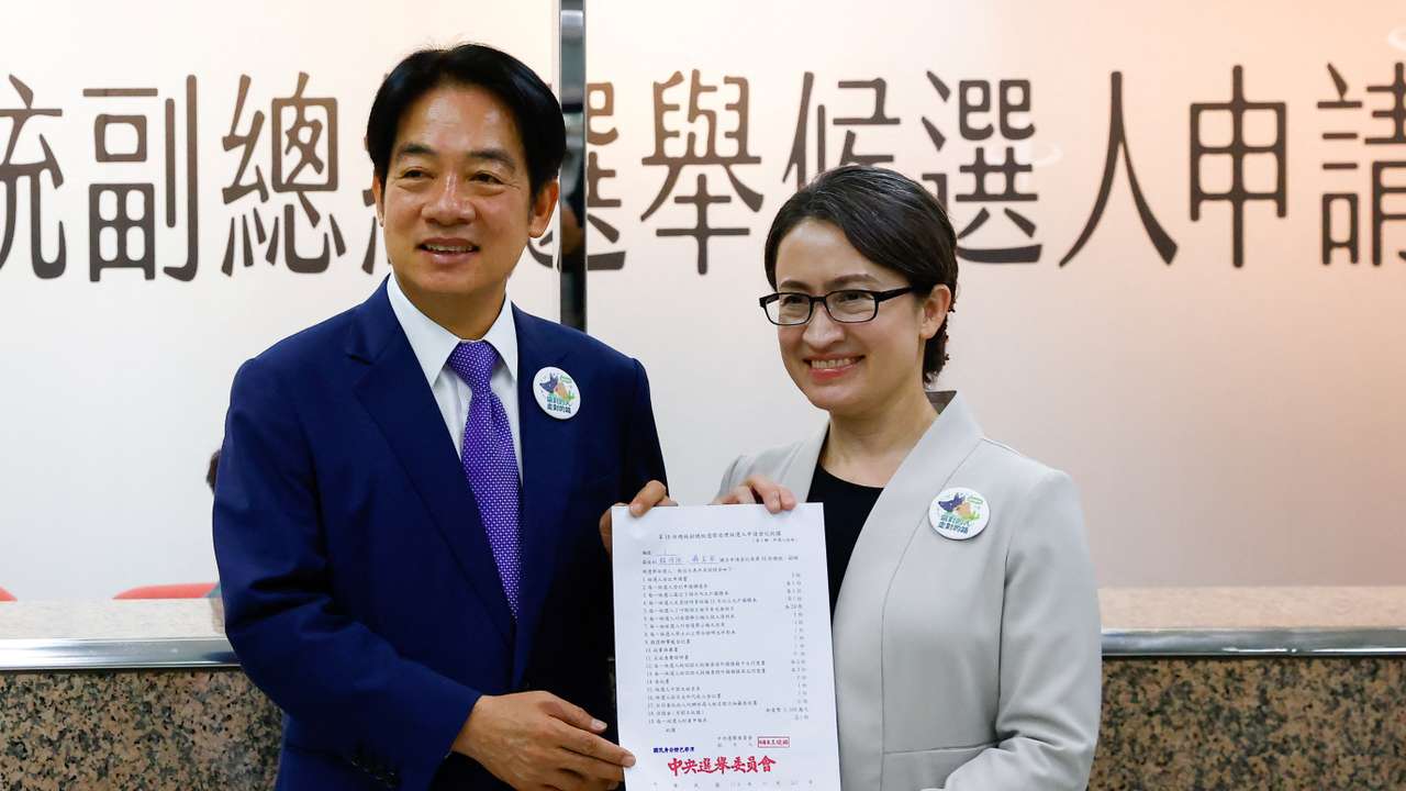 Taiwan's Vice President Lai Ching-te and running mate Hsiao Bi-Khim pose for a photo after registering for the upcoming presidential election, in Taipei
