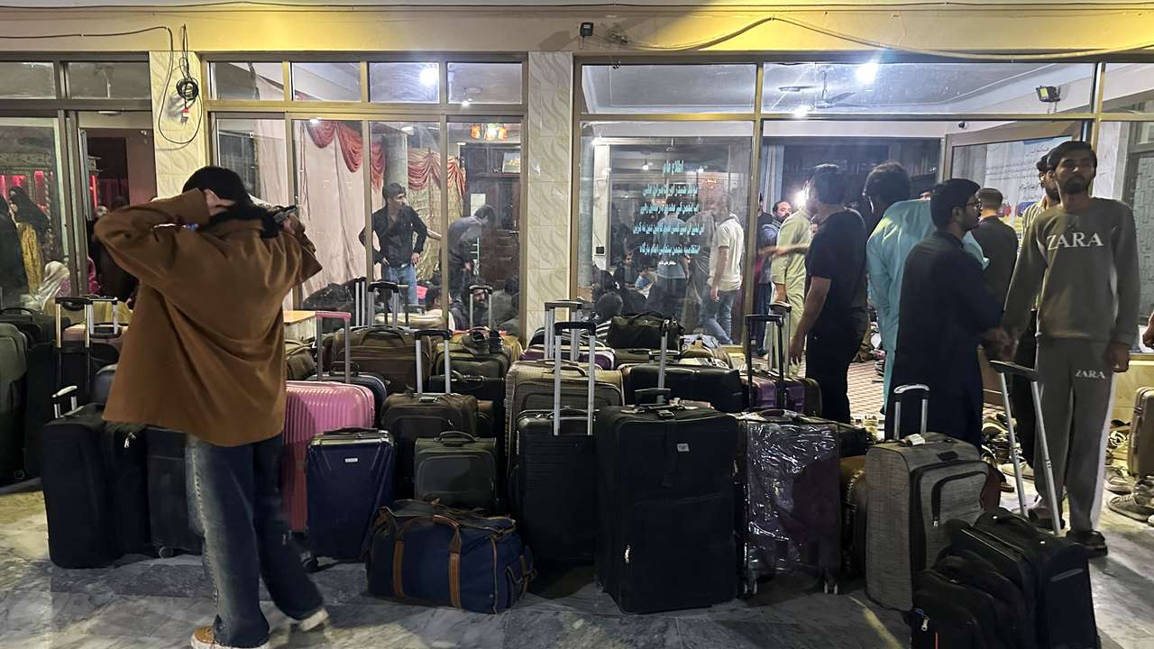 Pakistani students stand next to their luggage after their reutrn from Iran, amid the U.S.-Israeli conflict with Iran, in Quetta
