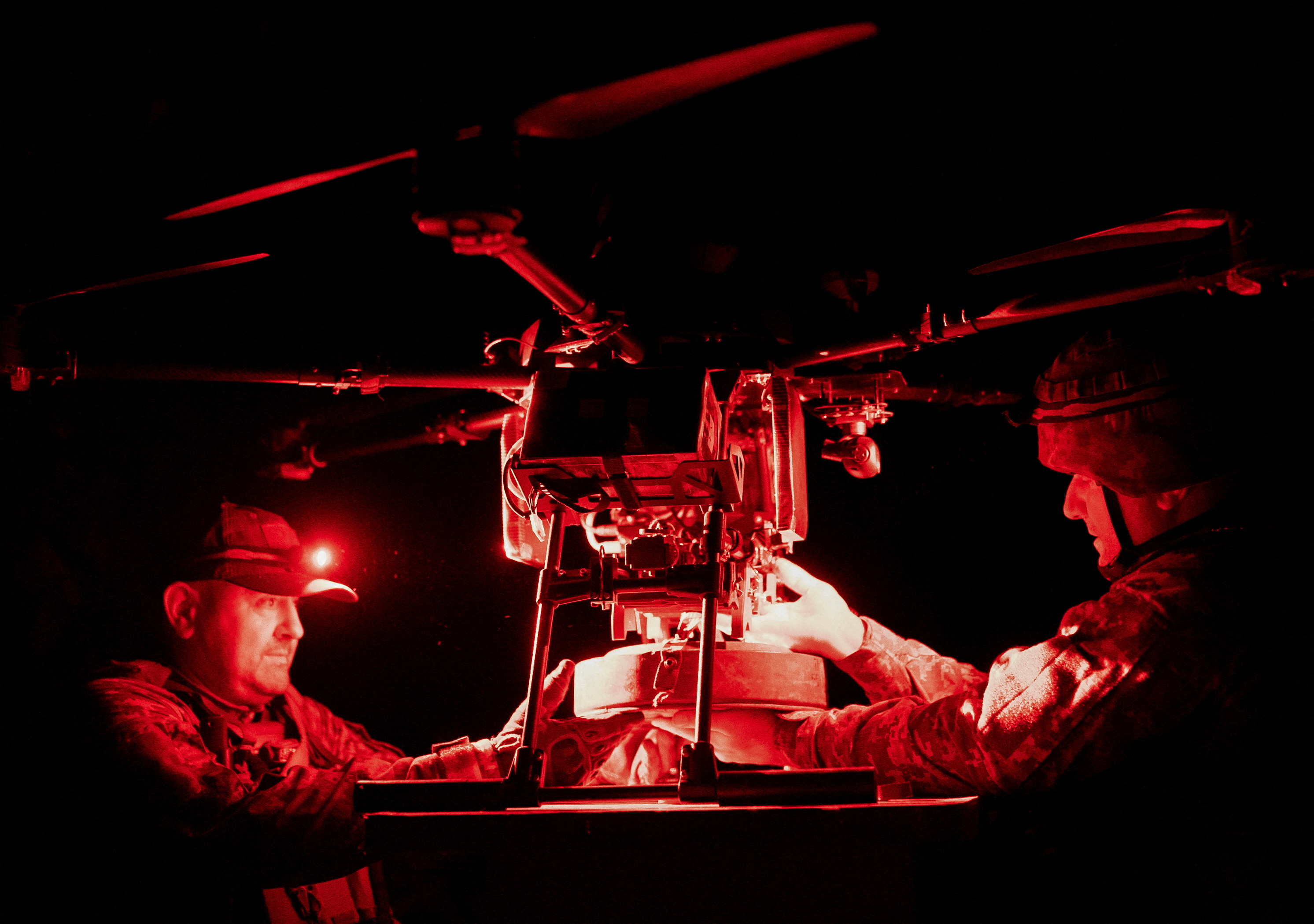 FILE PHOTO: Ukrainian servicemen attach an anti-tank mine to a Vampire combat drone before flying over positions of Russian troops in the frontline town of Chasiv Yar