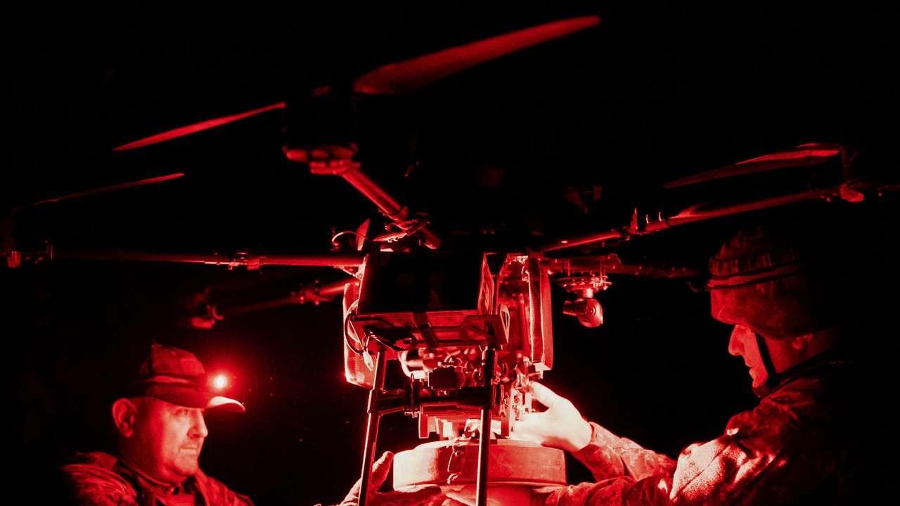 FILE PHOTO: Ukrainian servicemen attach an anti-tank mine to a Vampire combat drone before flying over positions of Russian troops in the frontline town of Chasiv Yar