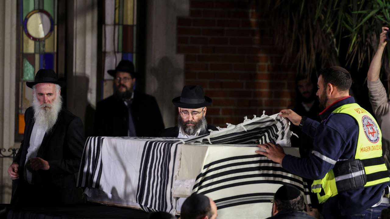 Mourners attend the funeral of Israeli rabbi, Zvi Kogan, in Kfar Habad