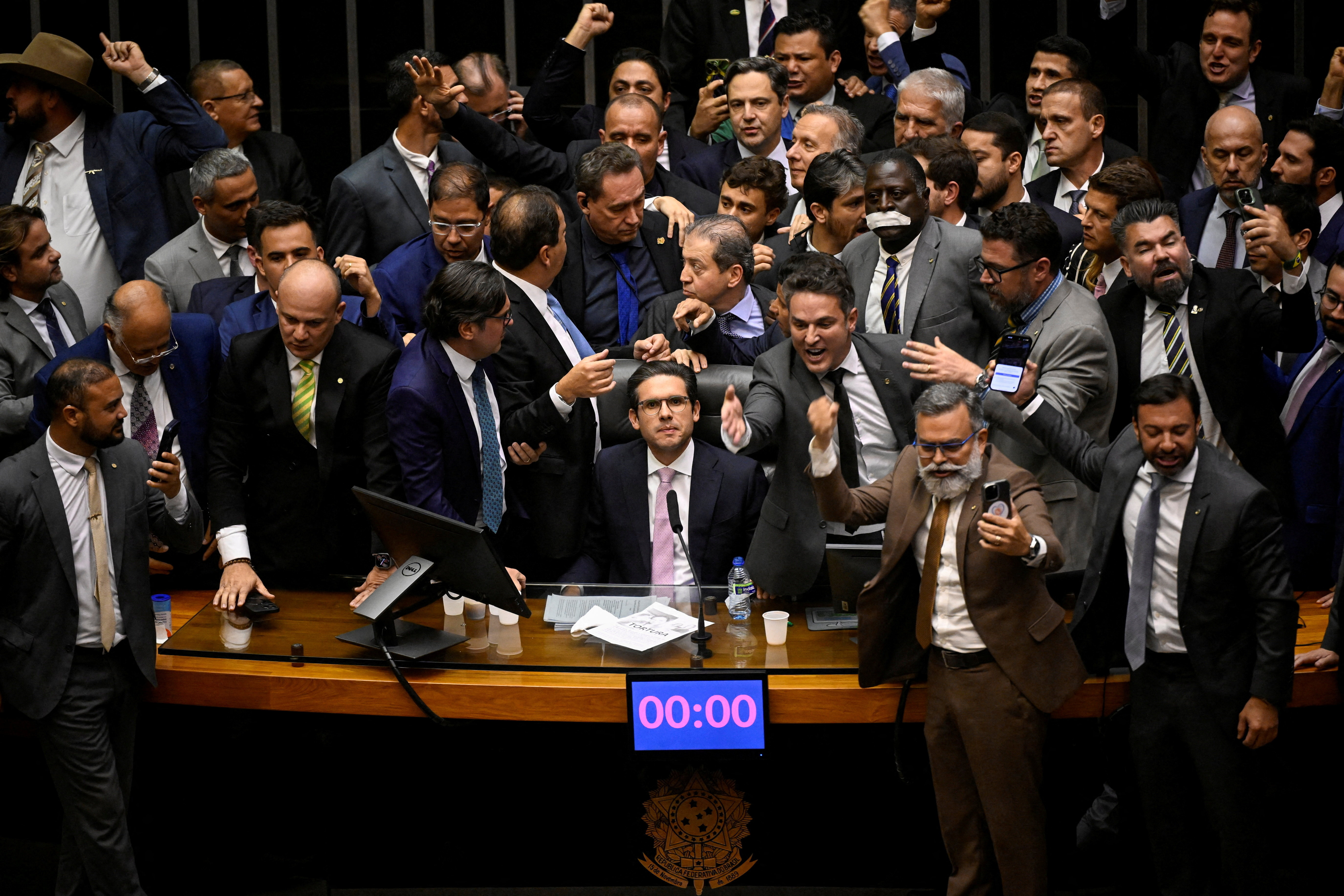 Allies of former president Bolsonaro block the resumption of sessions at the Chamber of Deputies after the mid-year recess in protest against his house arrest, in Brasilia