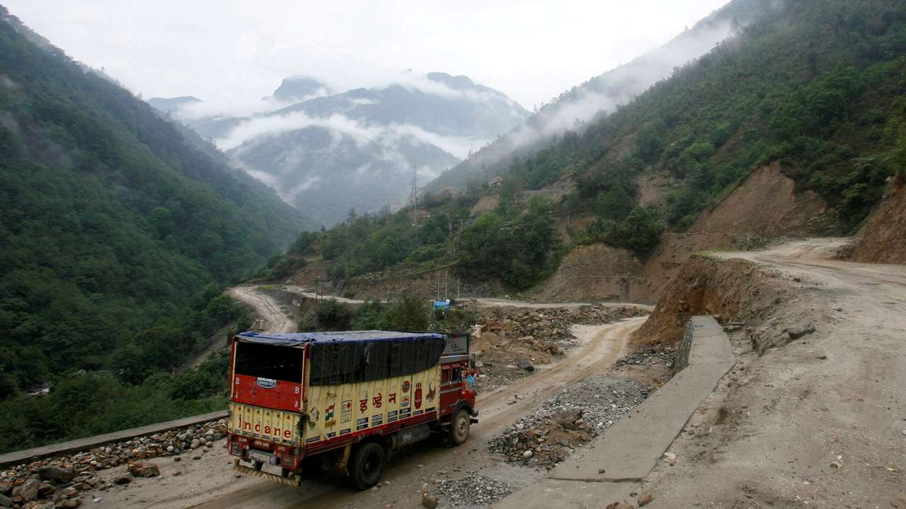 FILE PHOTO: A liquefied petroleum gas delivery truck drives along India's Tezpur-Tawang highway which runs to the Chinese border, in the northeastern Indian state of Arunachal Pradesh
