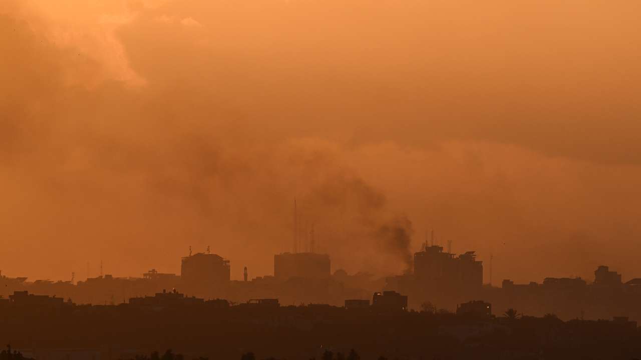 Smoke rises from Gaza, as the sun sets, amid the ongoing conflict between Israel and the Palestinian Islamist group Hamas, as seen from Sderot