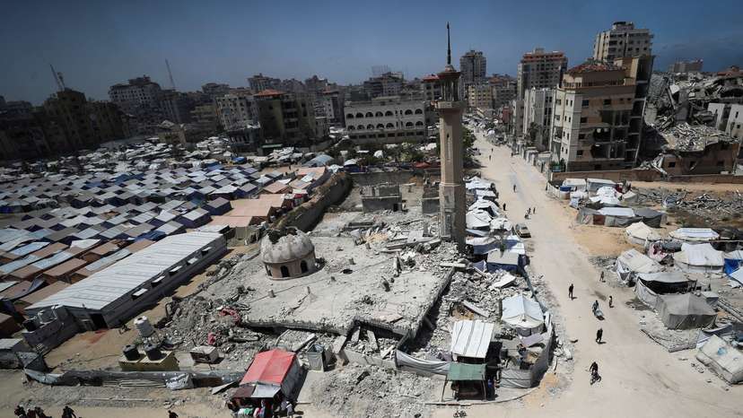 Palestinians displaced by the Israeli military offensive, shelter in tents, in Gaza