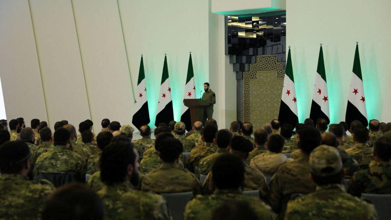 FILE PHOTO: Syria's de facto leader Ahmed al-Sharaa talks during a meeting, in Damascus