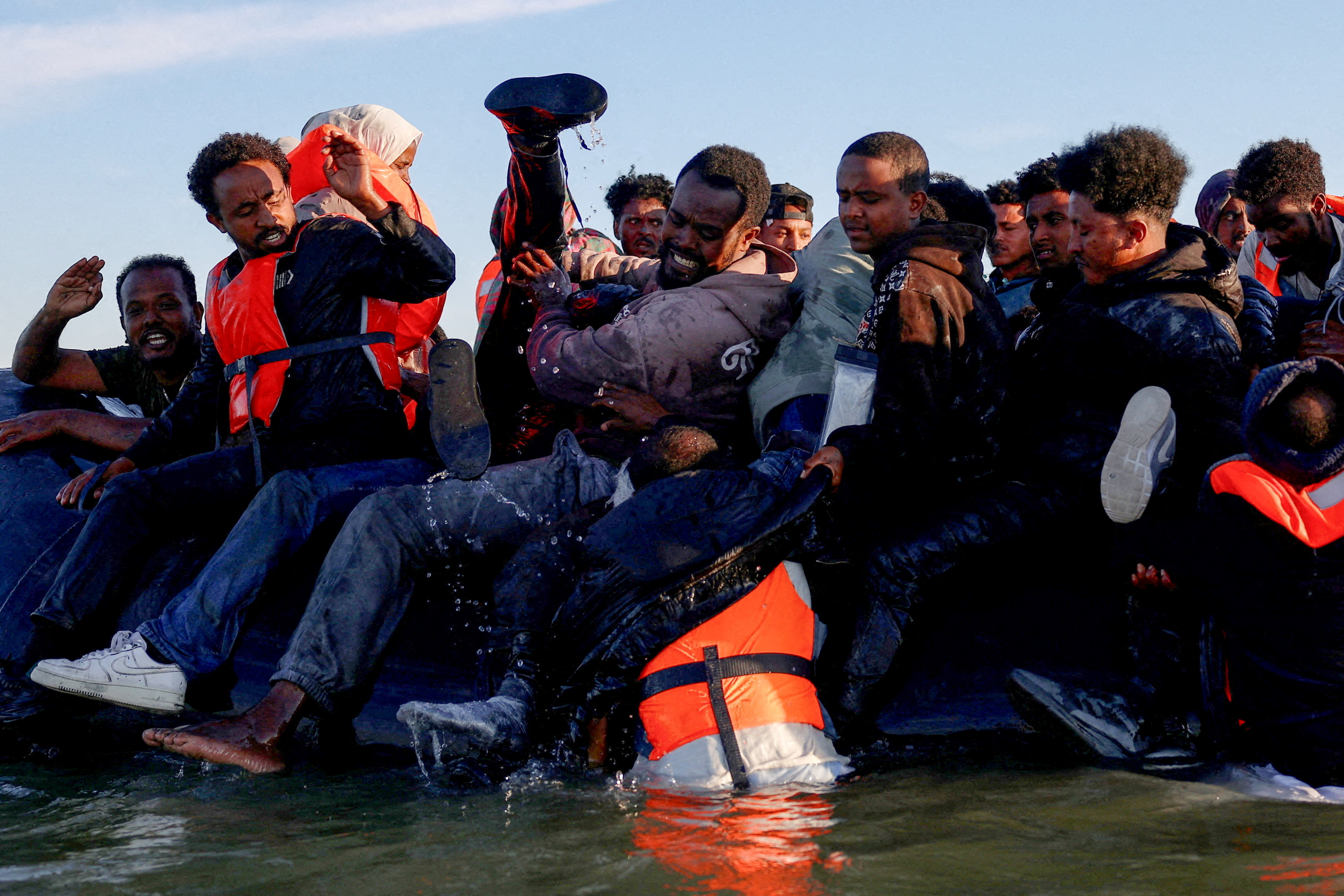 FILE PHOTO: Migrants attempt to cross the English channel from northern France