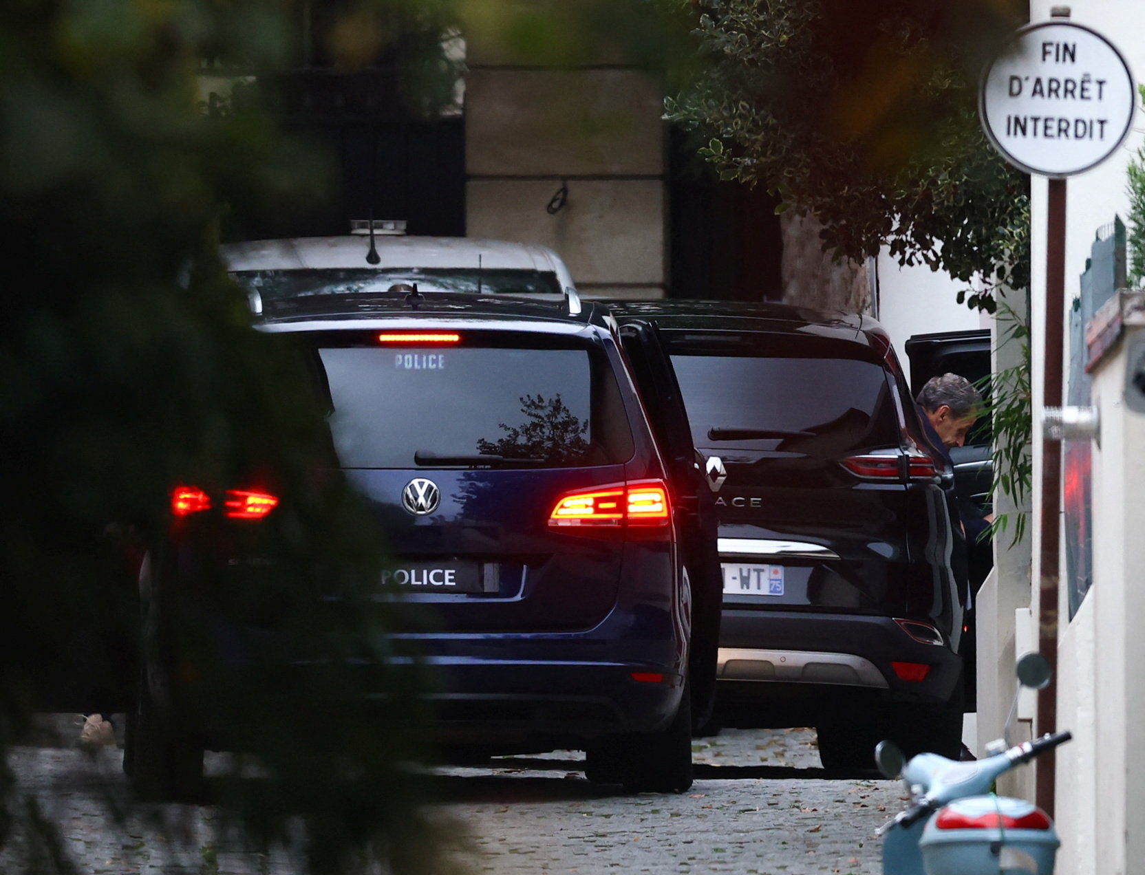 Former French President Sarkozy arrives at his house after being released from jail, in Paris