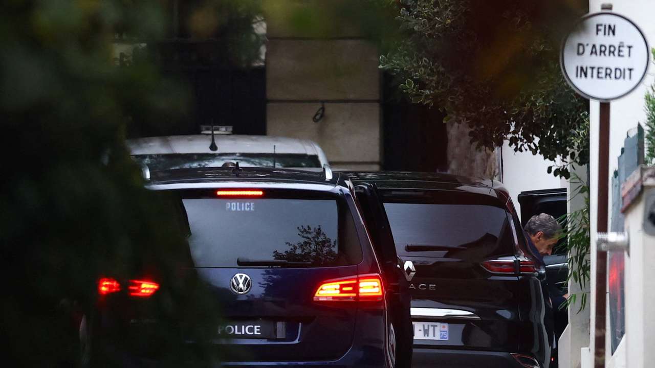 Former French President Sarkozy arrives at his house after being released from jail, in Paris