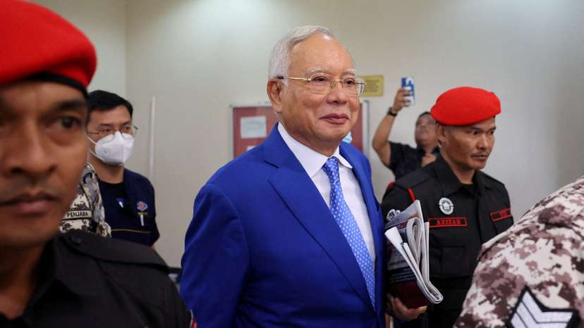 FILE PHOTO: Former Malaysian Prime Minister Najib Razak escorted by prison officers as the jailed politician left the court after court proceedings in Kuala Lumpur
