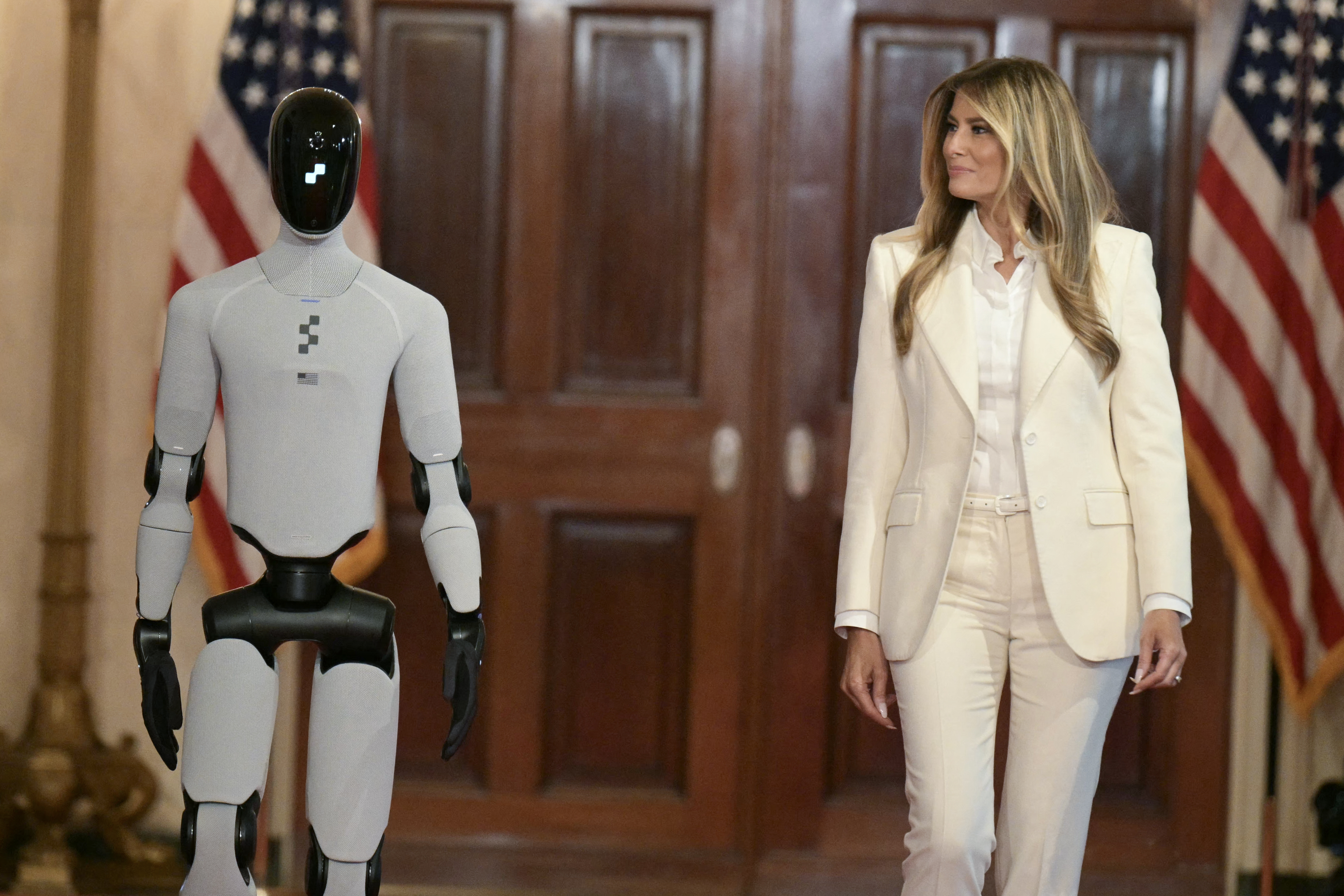 US First Lady Melania Trump walks red carpet with humanoid robot at White House