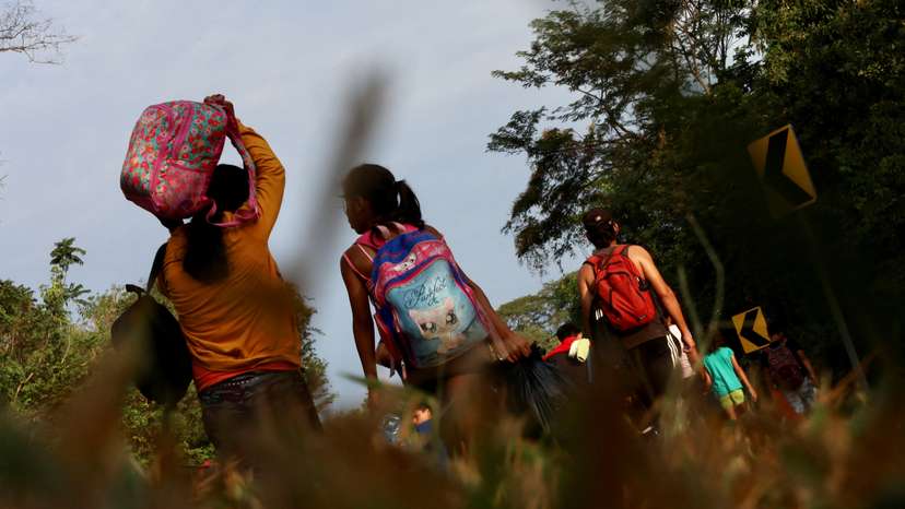Migrants continue walking in a caravan to reach the U.S. border through Mexico, in Escuintla
