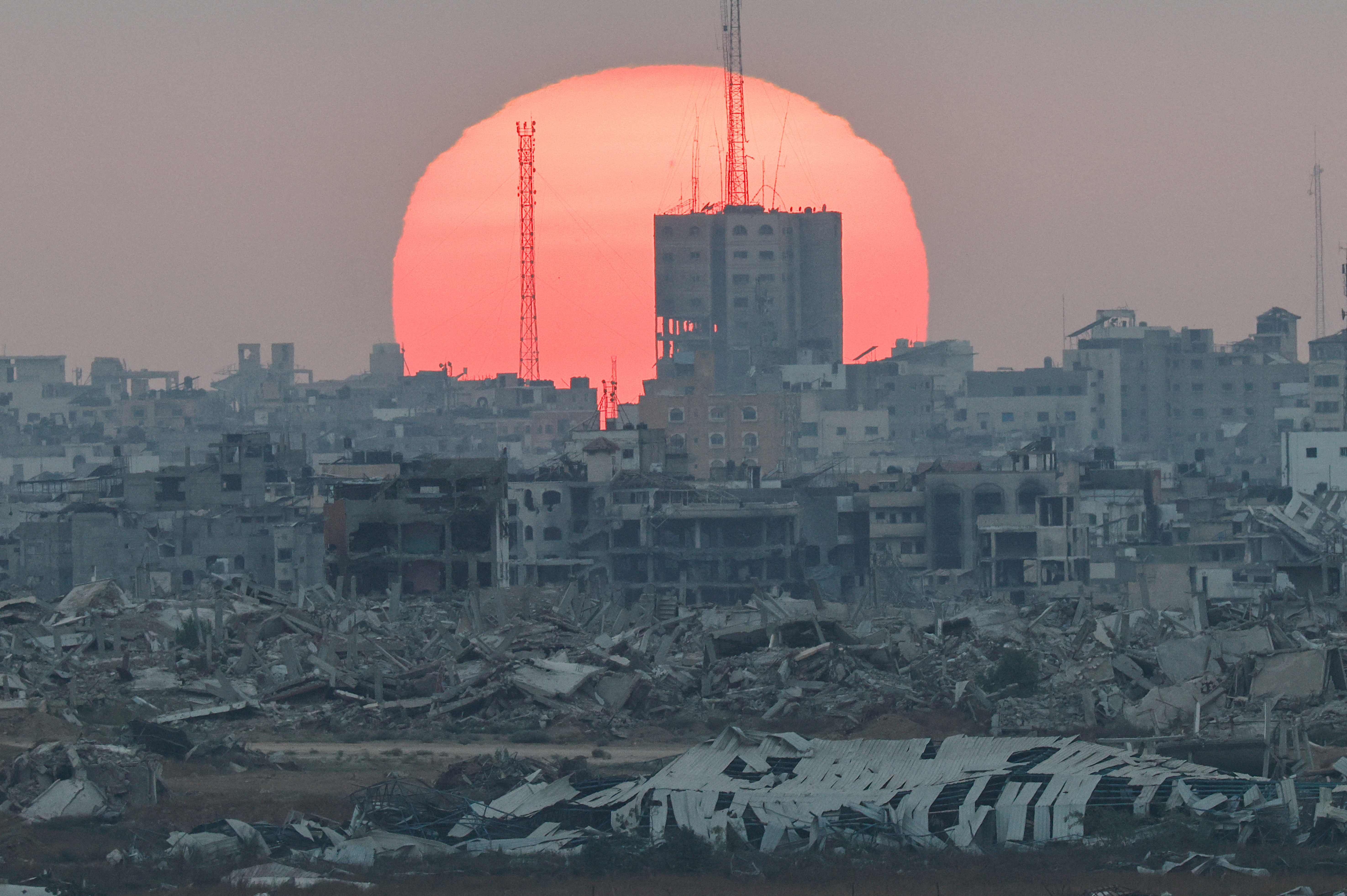 The sun sets over Gaza, as seen from Israel
