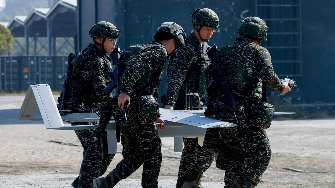 FILE PHOTO: Taiwanese soldiers carry a land-based Surveillance UAV/UAS during an annual military exercise ahead of the Lunar New Year, in Kaohsiung
