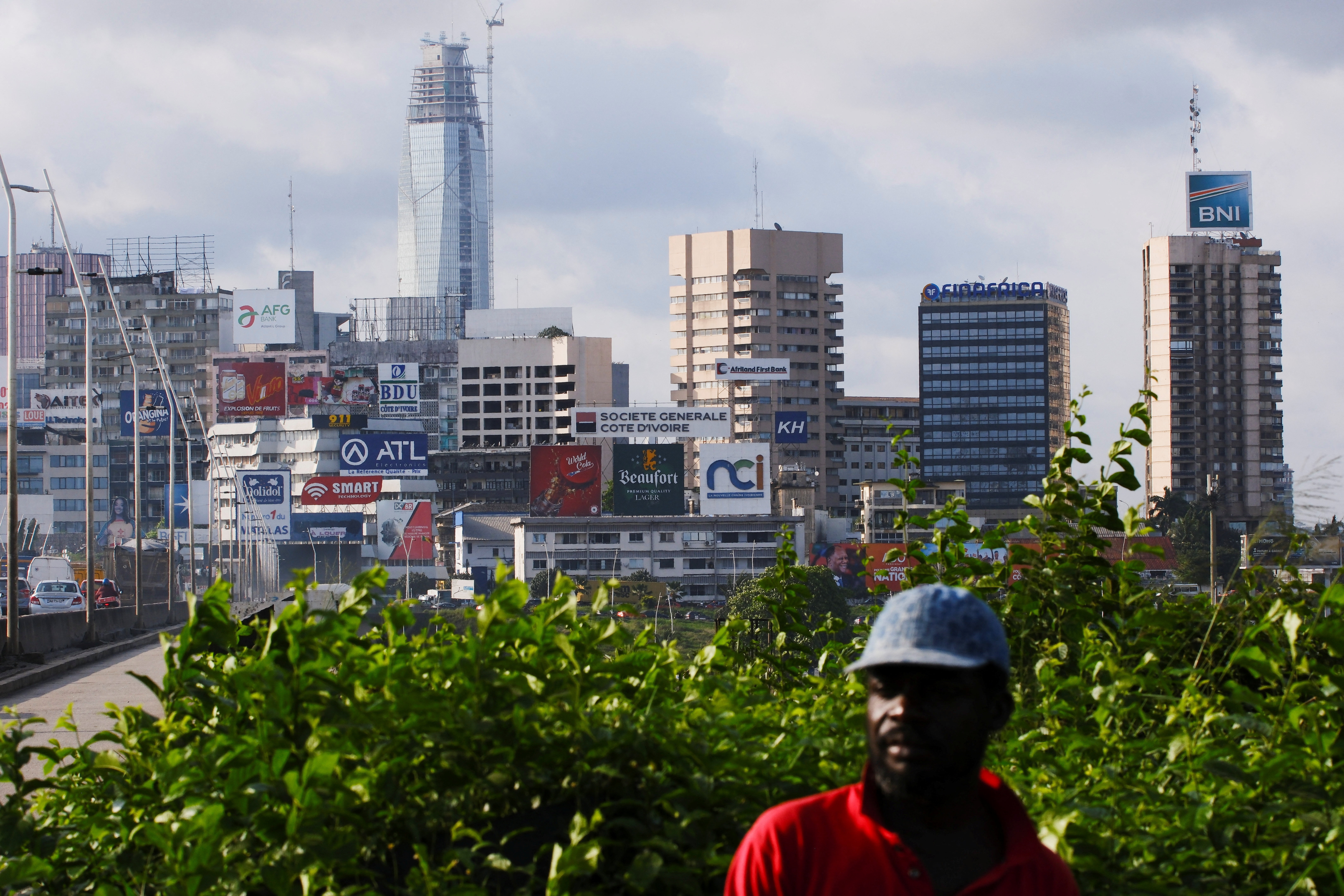 Supporters of Ivory Coast's President Alassane Ouattara, who is seeking a fourth term, attend his last campaign rally