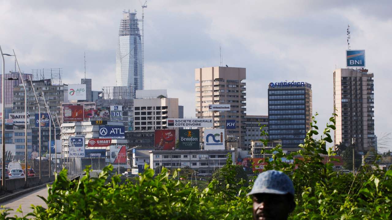 Supporters of Ivory Coast's President Alassane Ouattara, who is seeking a fourth term, attend his last campaign rally