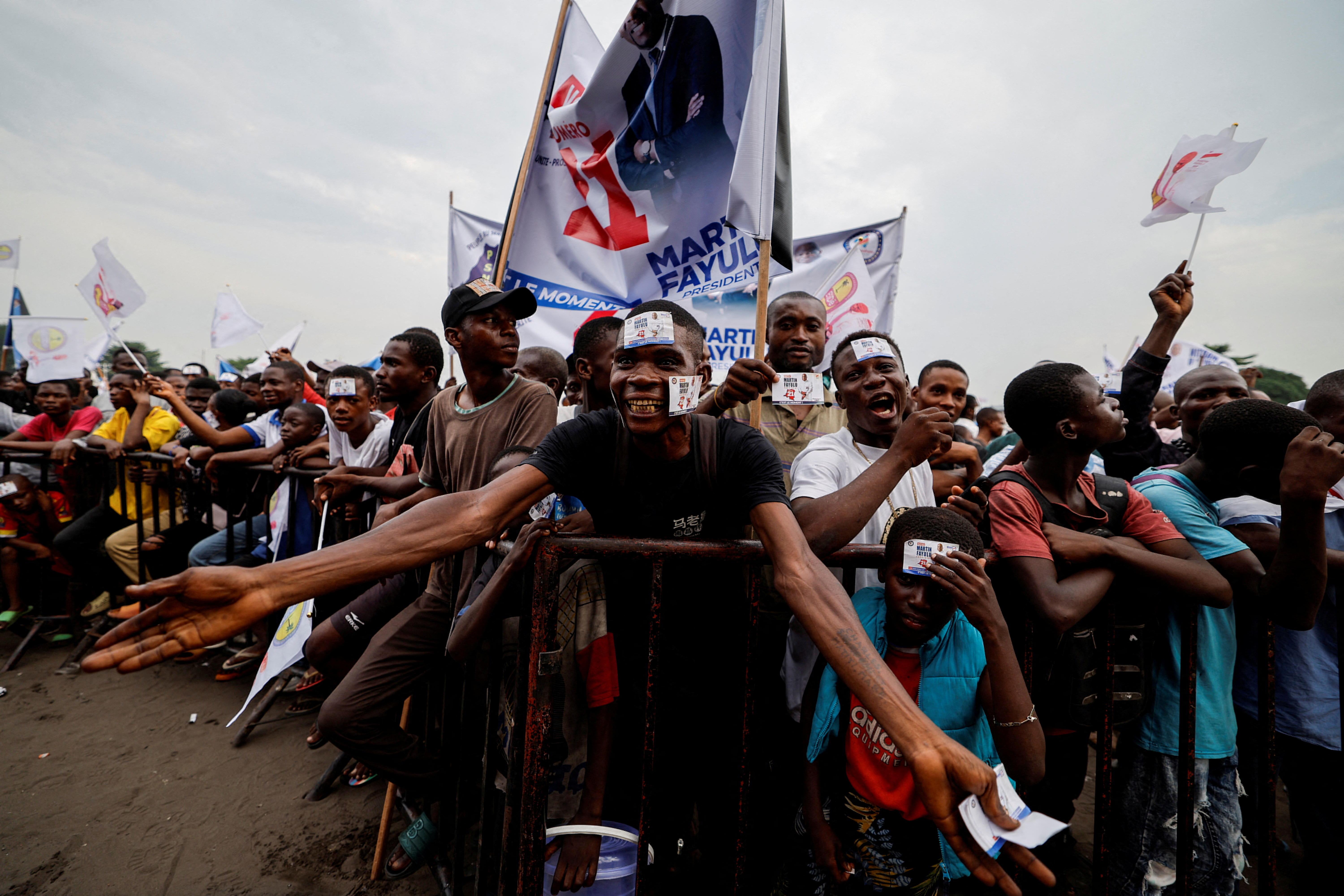 Supporters react at Congolese presidential candidate Fayulu campaign rally in Kinshasa