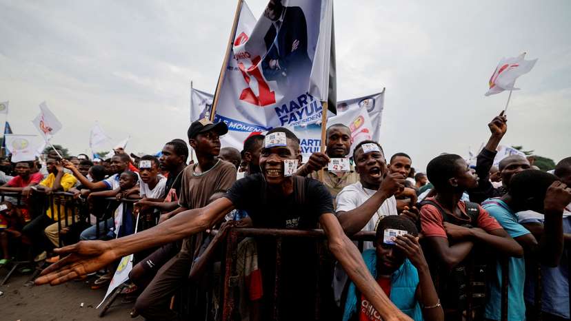 Supporters react at Congolese presidential candidate Fayulu campaign rally in Kinshasa