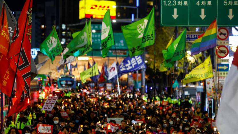 People protest during a candlelight vigil calling for the resignation of South Korean President Yoon Suk Yeol, in Seoul