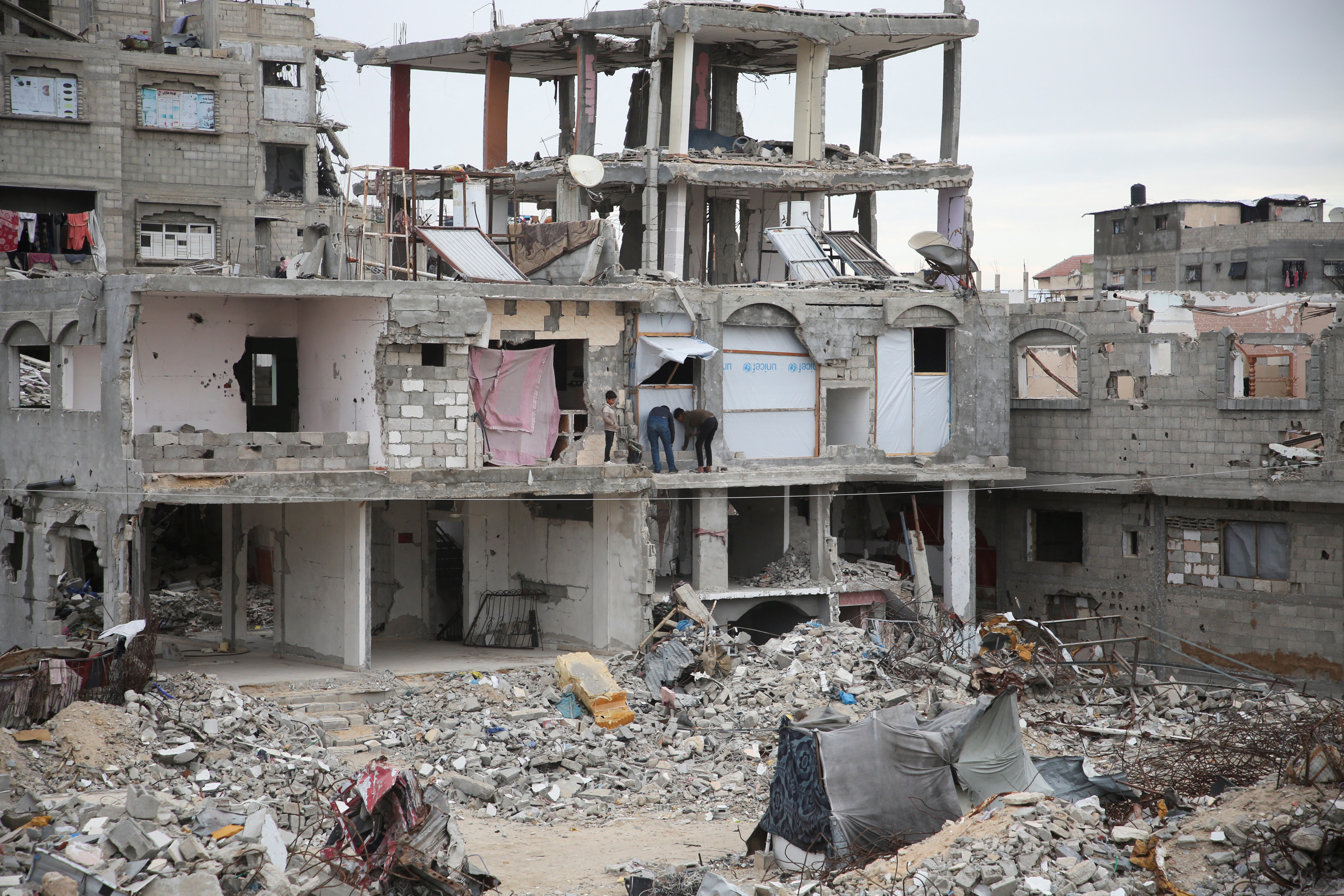 Buildings destroyed in the Israeli offensive lie in ruins, in Khan Younis in the southern Gaza Strip
