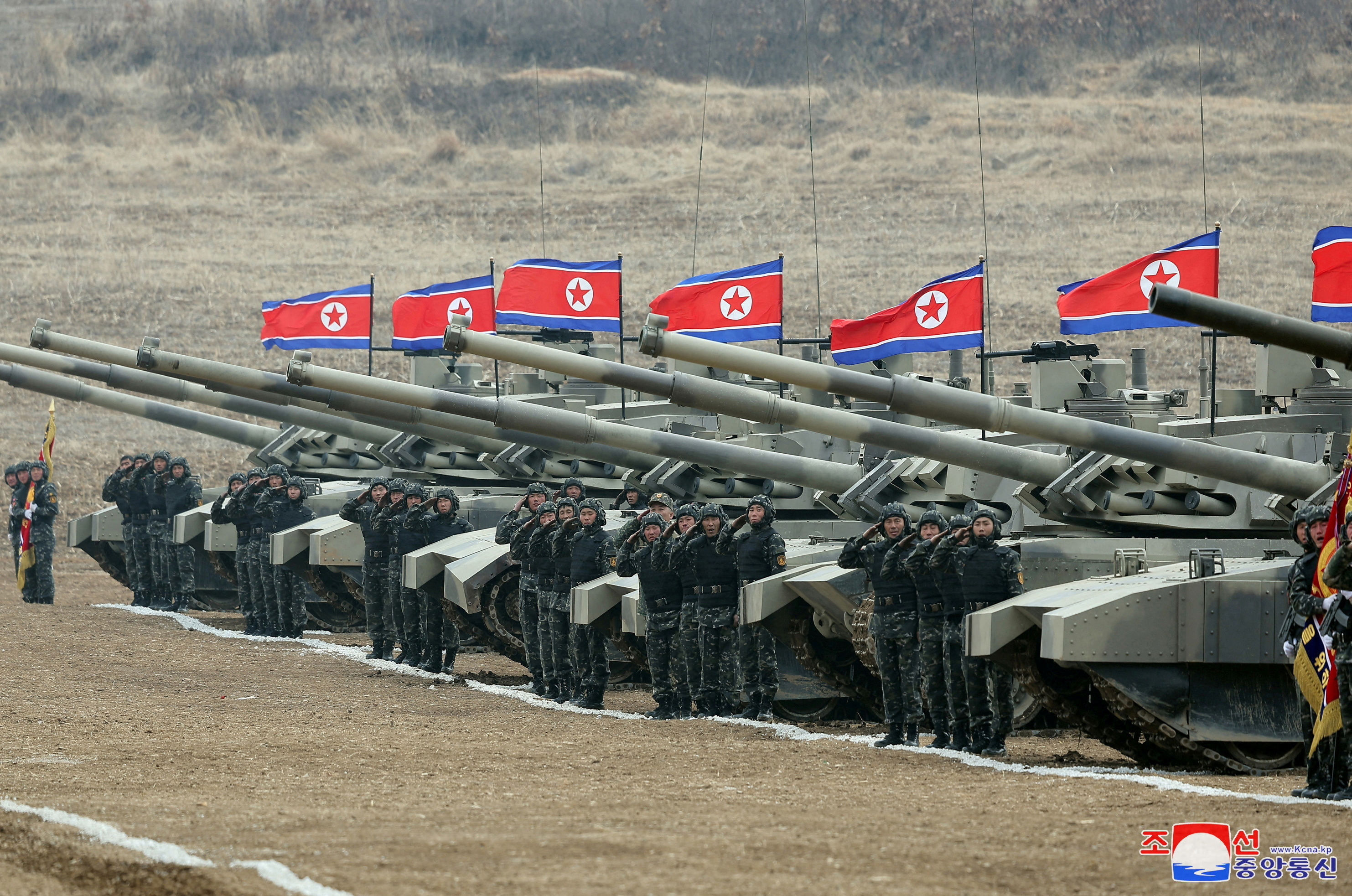 FILE PHOTO: North Korean leader Kim Jong Un guides a military demonstration involving tank units