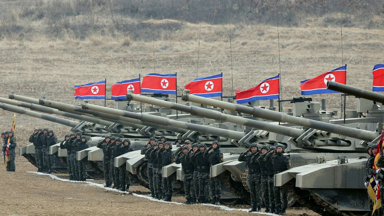 FILE PHOTO: North Korean leader Kim Jong Un guides a military demonstration involving tank units