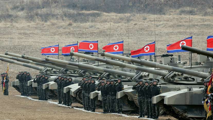 FILE PHOTO: North Korean leader Kim Jong Un guides a military demonstration involving tank units