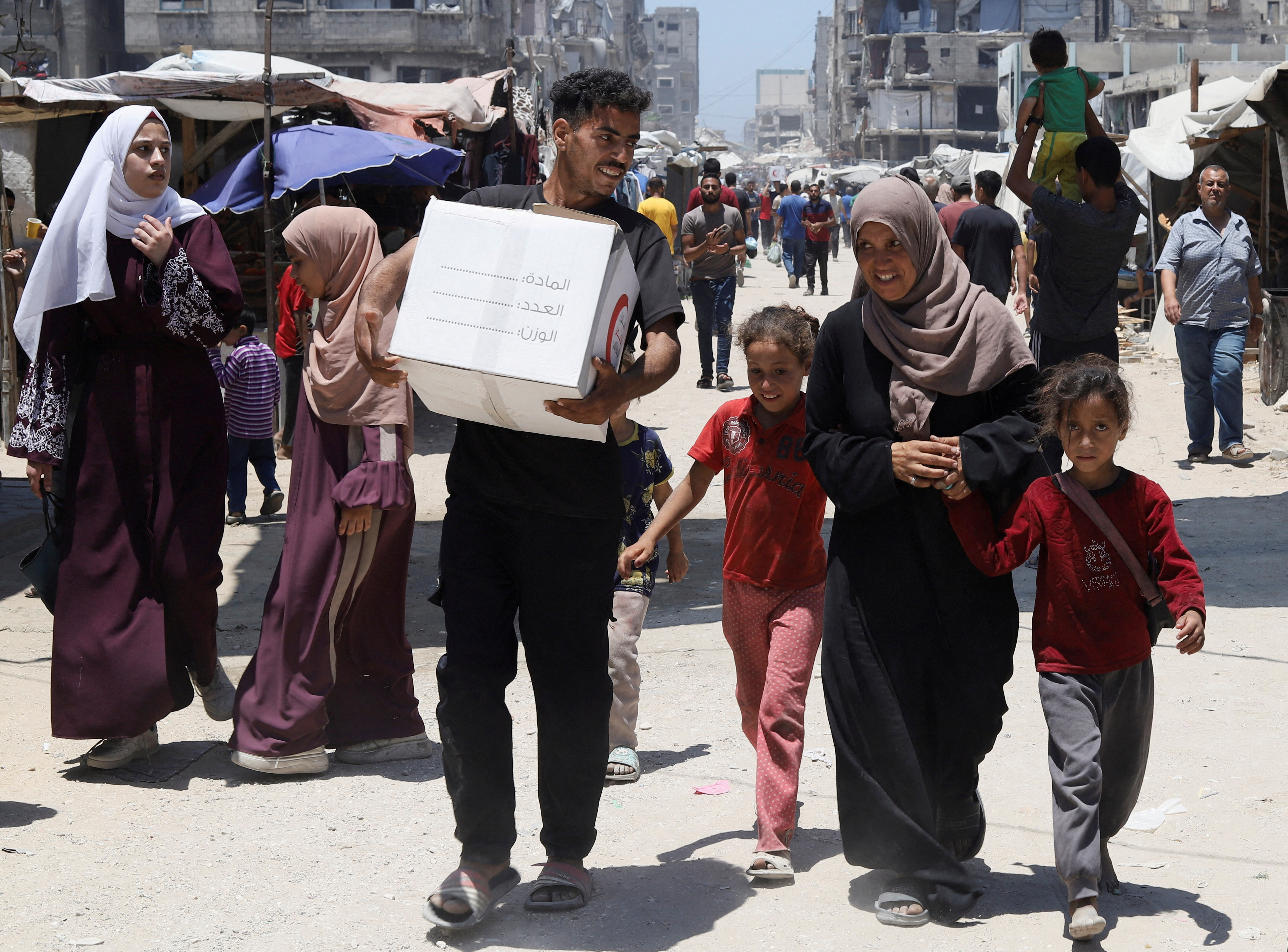 FILE PHOTO: Displaced Palestinian family in Gaza City receives first aid in months in Gaza City
