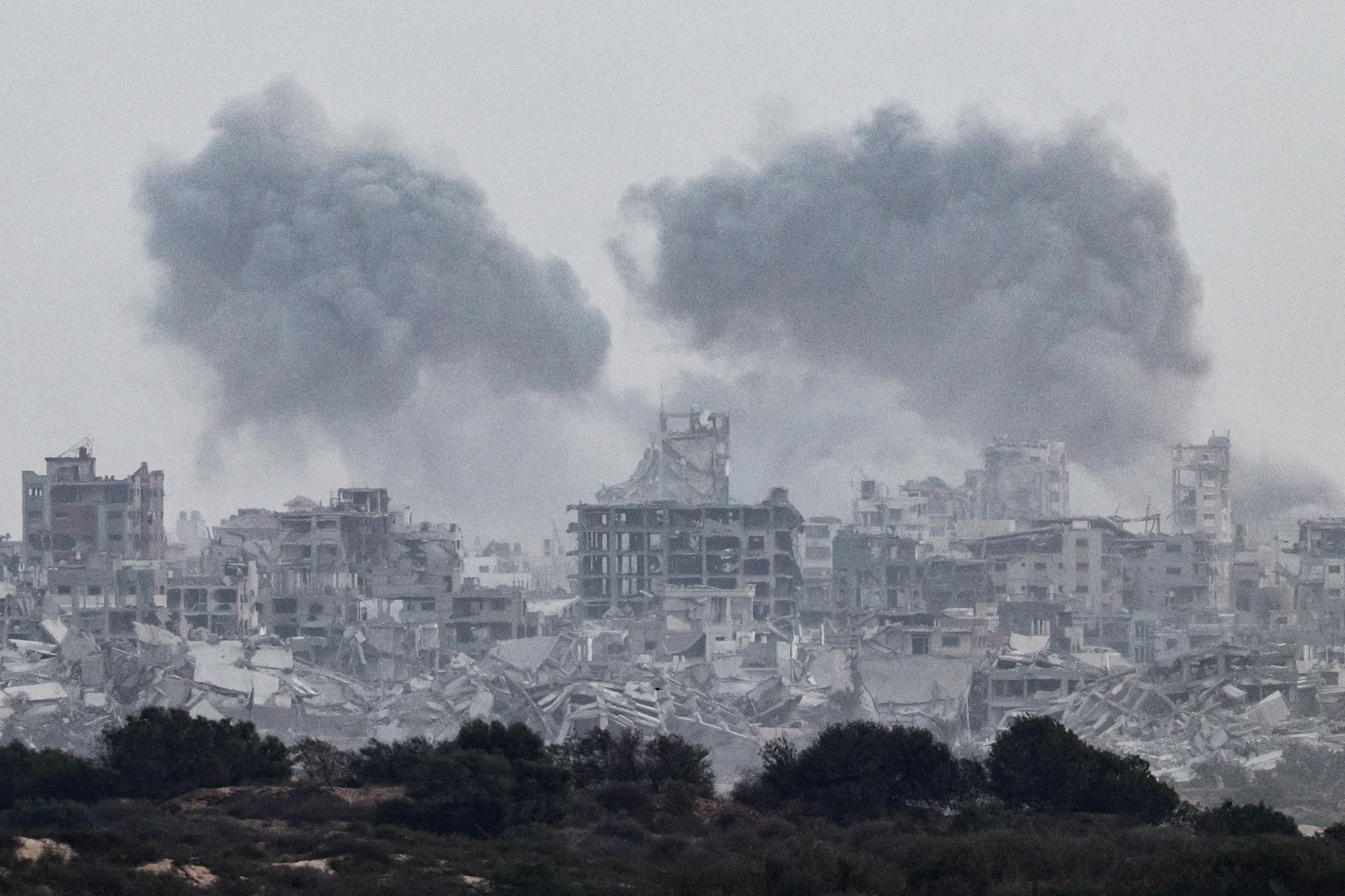 Smoke rises from Gaza after explosions, as seen from Israel