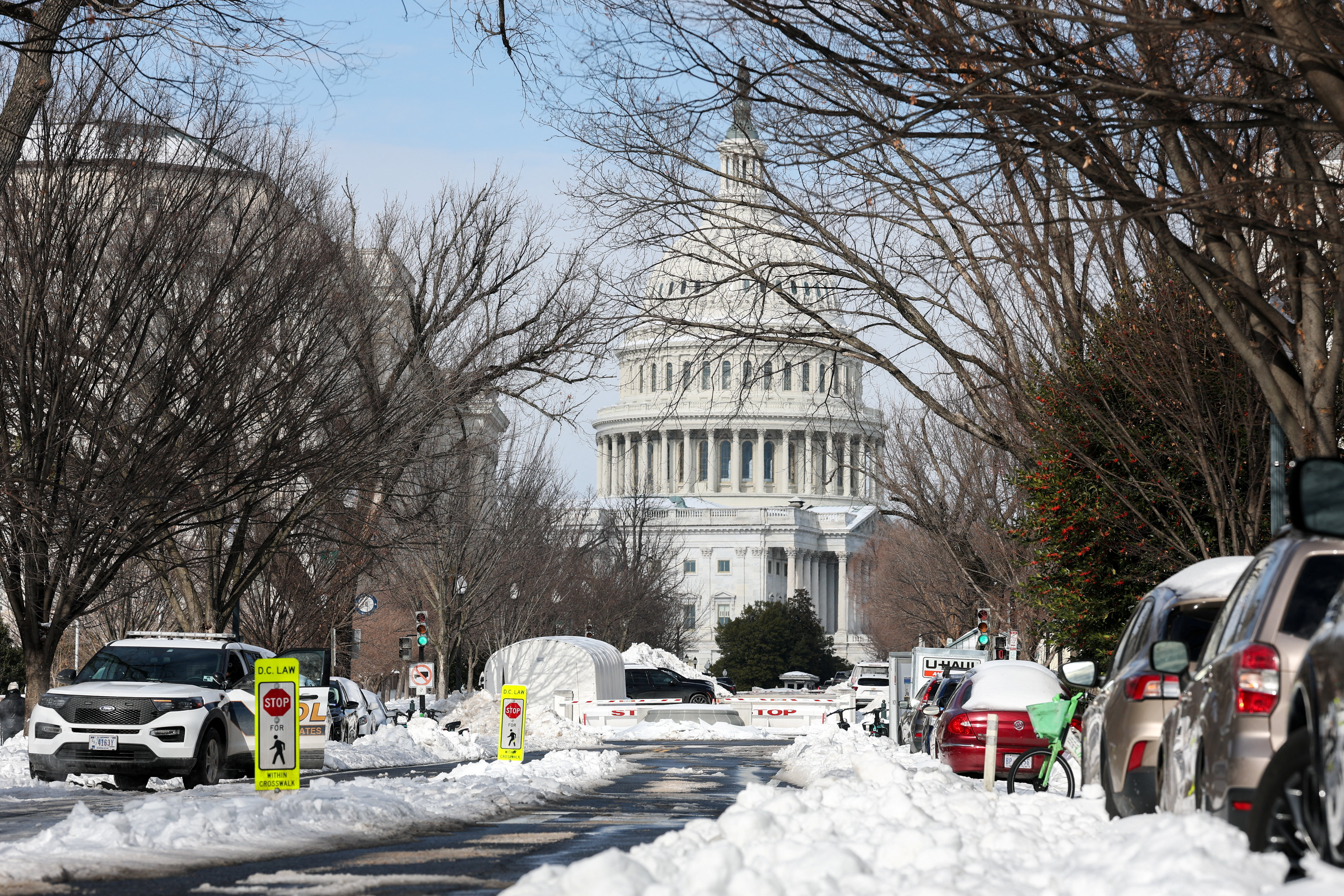 Snow covers a street near the U.S. Capitol building, two days after a winter storm in Washington