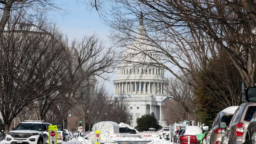 Snow covers a street near the U.S. Capitol building, two days after a winter storm in Washington