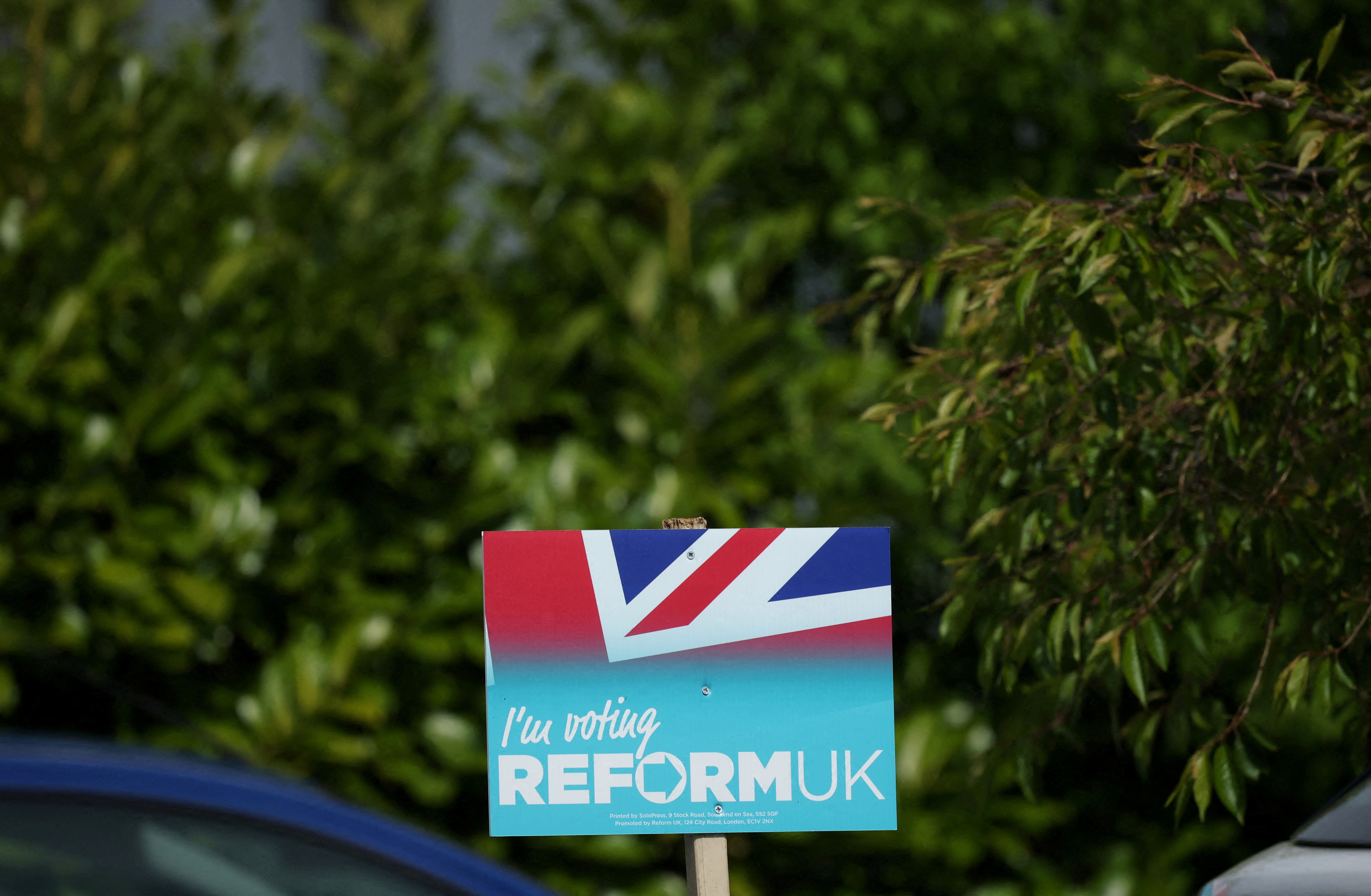 FILE PHOTO: A Reform UK party poster is seen outside a house ahead of the forthcoming Runcorn and Helsby parliamentary by-election in Frodsham, Britain