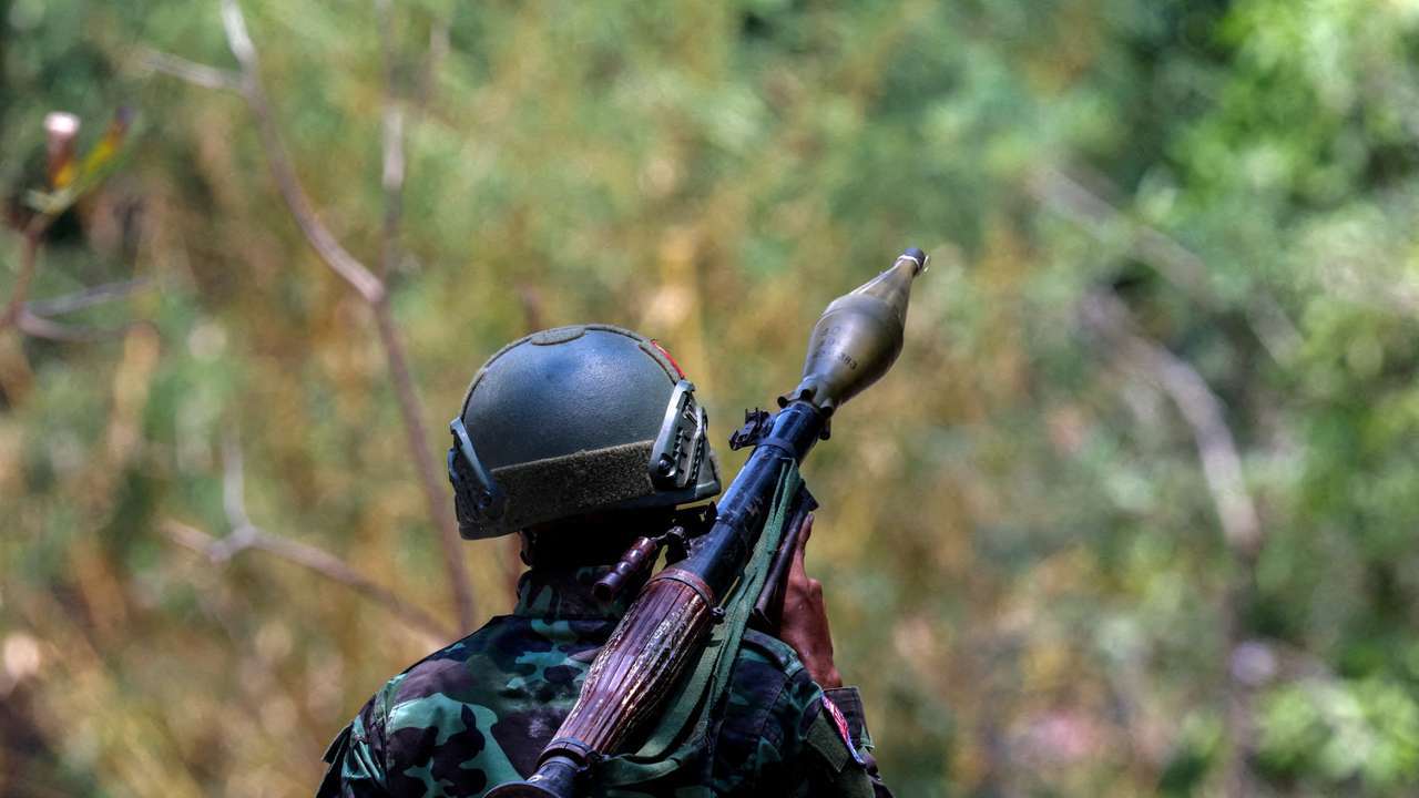 FILE PHOTO: A soldier from the Karen National Liberation Army (KNLA) carries an RPG launcher at a Myanmar military base at Thingyan Nyi Naung village on the outskirts of Myawaddy