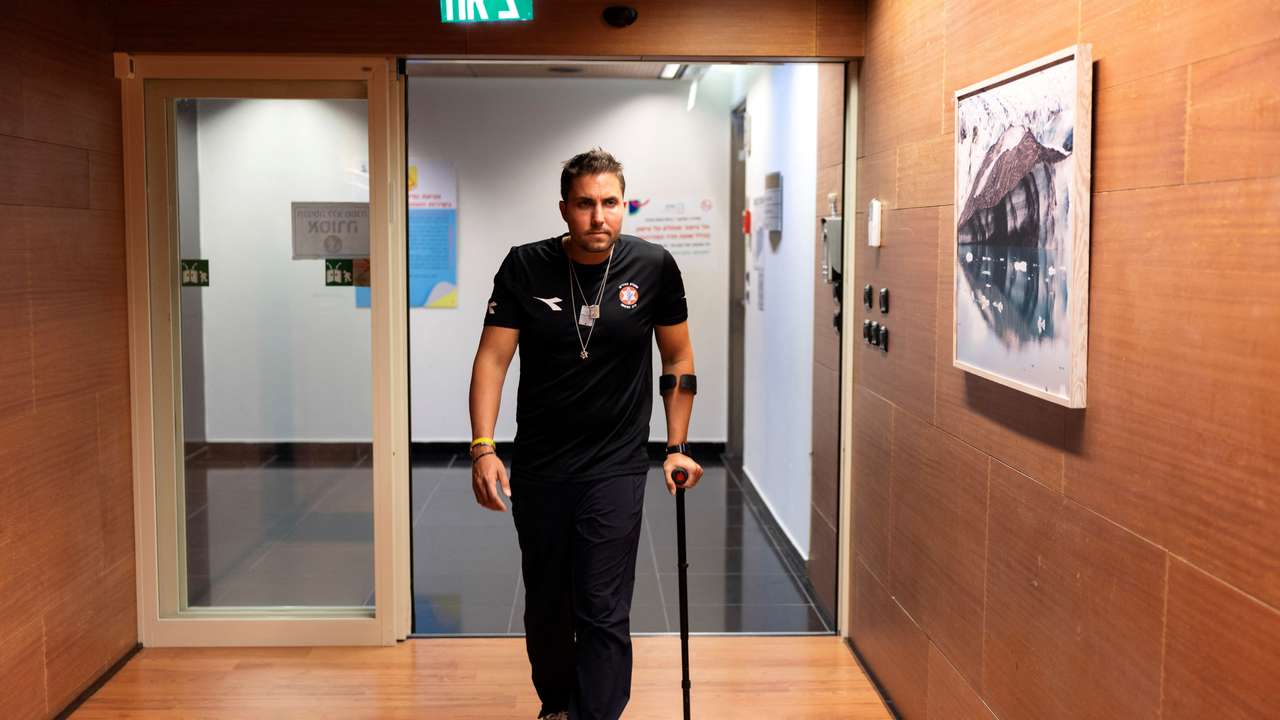 Yosi Sochr, 34, an Israeli reservist and father of four who was severely wounded fighting in Gaza, uses a crutch as he recovers at Sheba Medical Centre in Ramat Gan