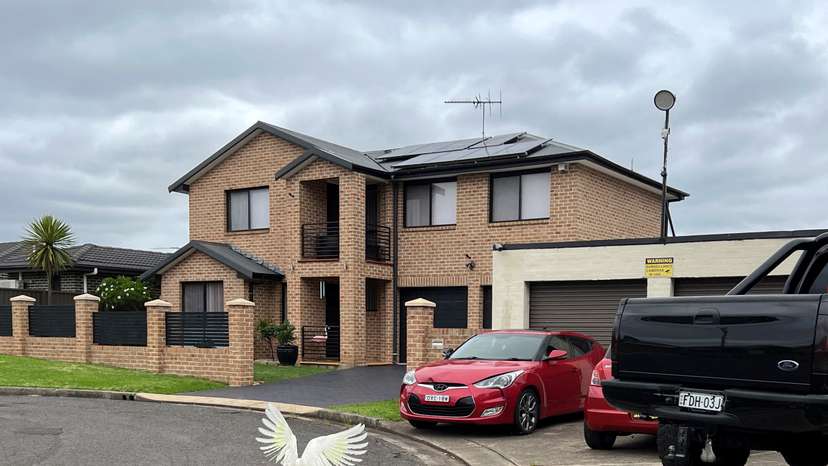 Cars park outside a house in Casula