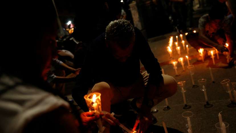 Family members of detainees protest outside the Helicoide detention centre, in Caracas