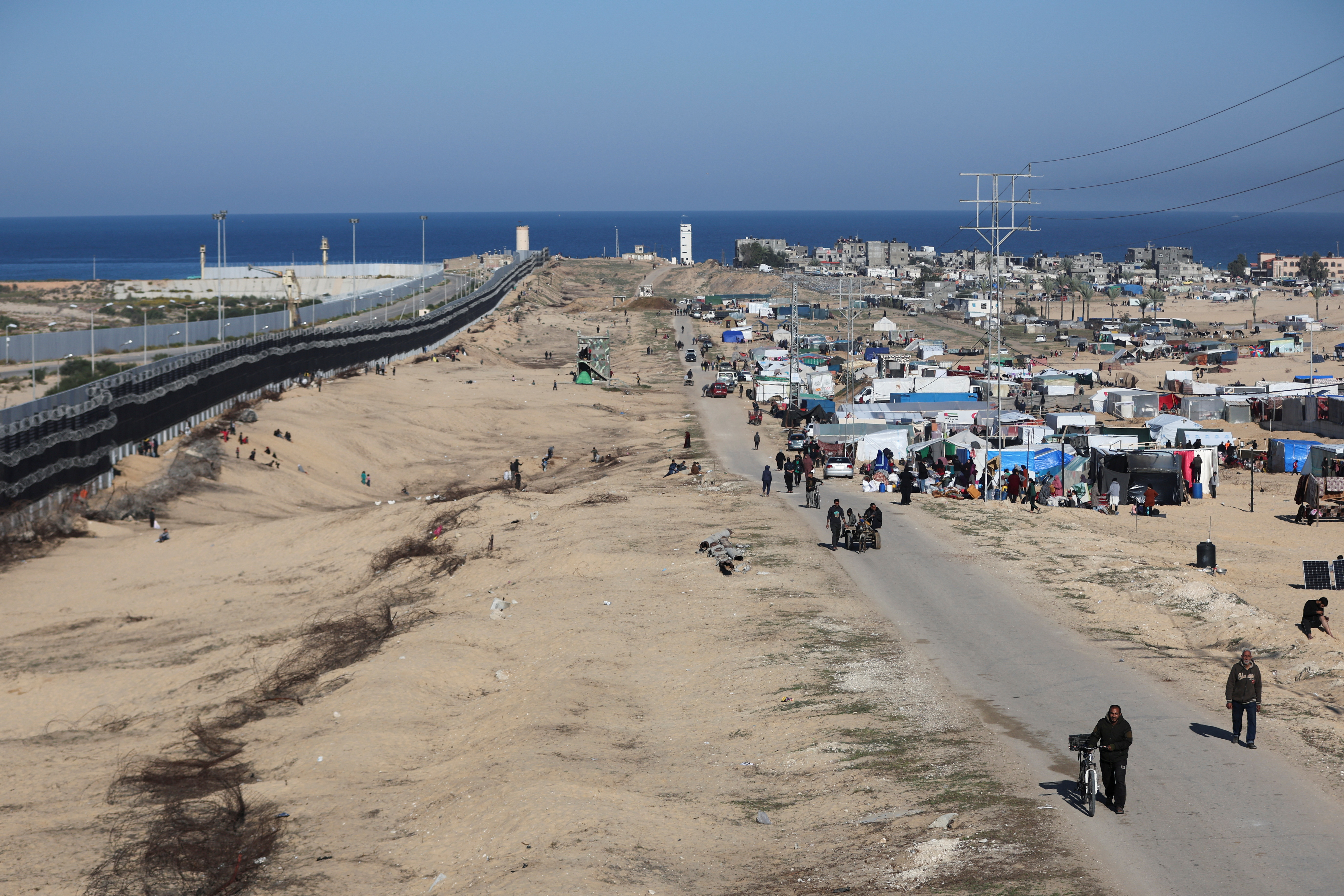 Displaced Palestinians shelter near the border with Egypt, in Rafah in the southern Gaza Strip