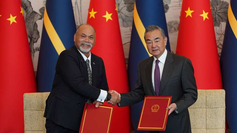 China's Foreign Minister Wang Yi hosts an event at the Diaoyutai State Guesthouse in Beijing