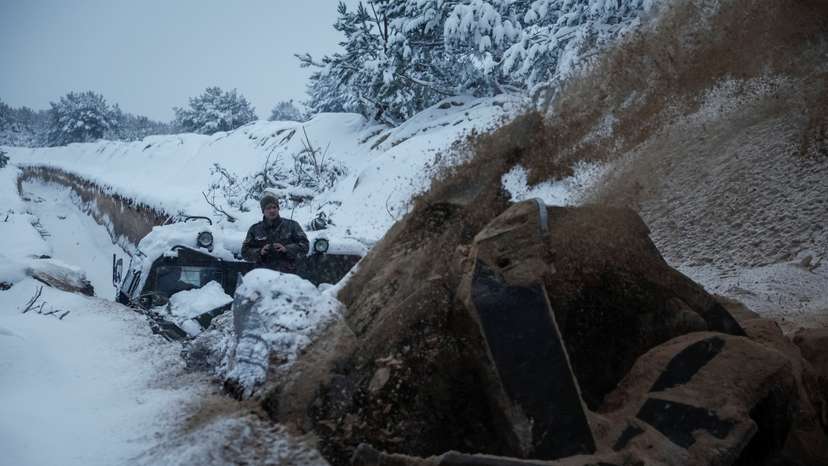 A Ukrainian serviceman digs an anti tank ditch with a MDK-3 military engineering vehicle near Belarus border in Chornobyl exclusion zone